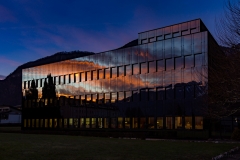 Sunrise in Vouvry reflects in an office building